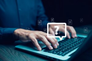 Man asking question on the computer about receiving a DBA