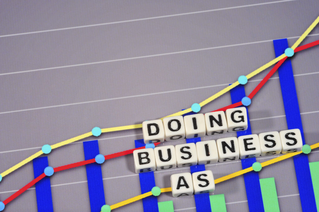 Doing Business As (DBA) term spelled on top of a positive line graph