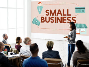 business woman giving a presentation on what constitutes a small business