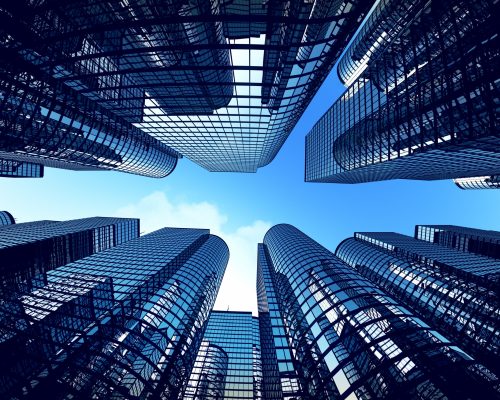 Low,Angle,Shot,Of,Modern,Glass,City,Buildings,During,Sunny